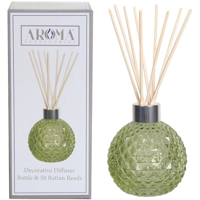 Bottiglia vuota verde con bastoncini diffusori in una scatola di Woodbridge Candle